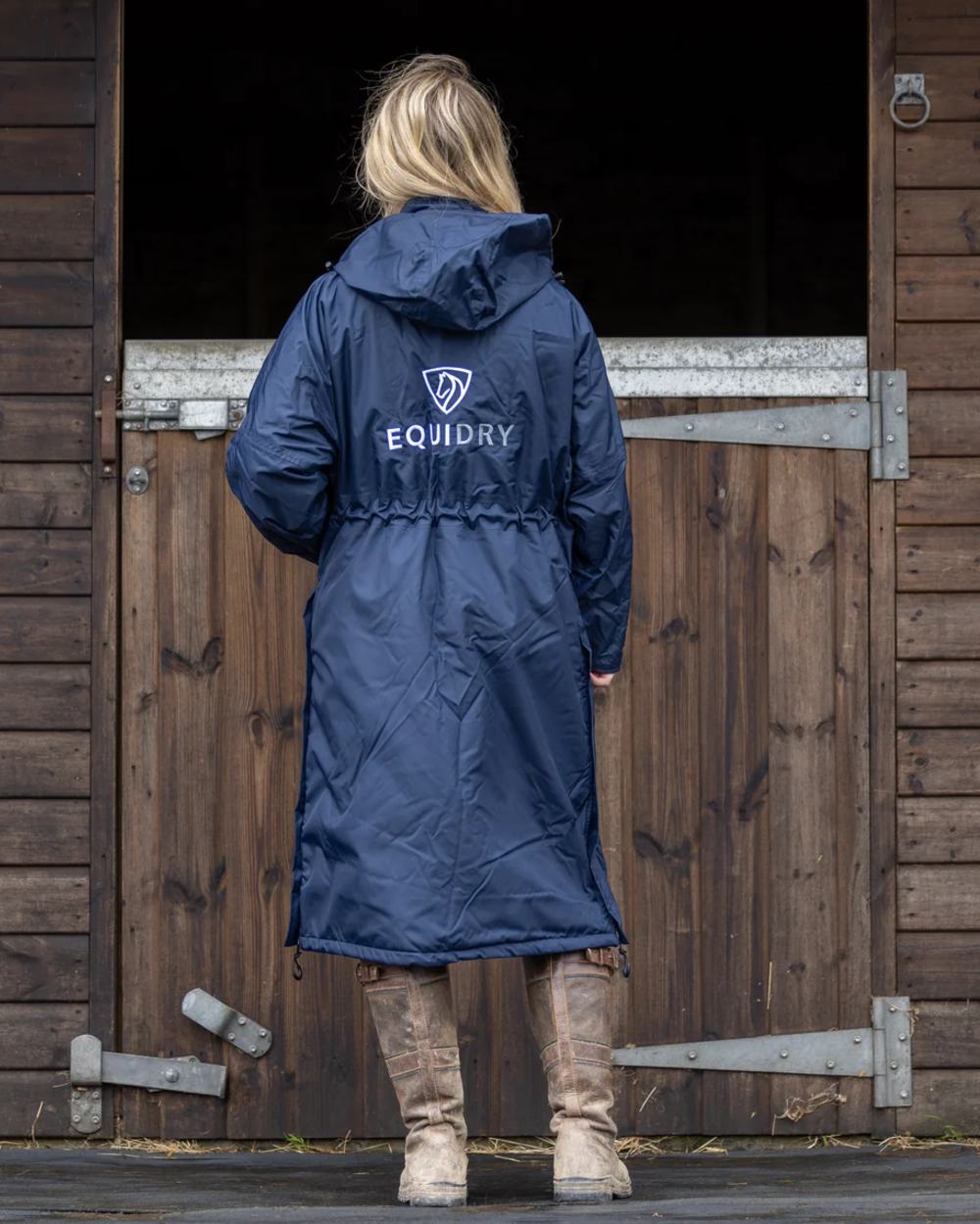 Navy coloured Equidry Womens Pro Ride Evolution Thin Fleece Coat With Stowaway Hood on outdoor background