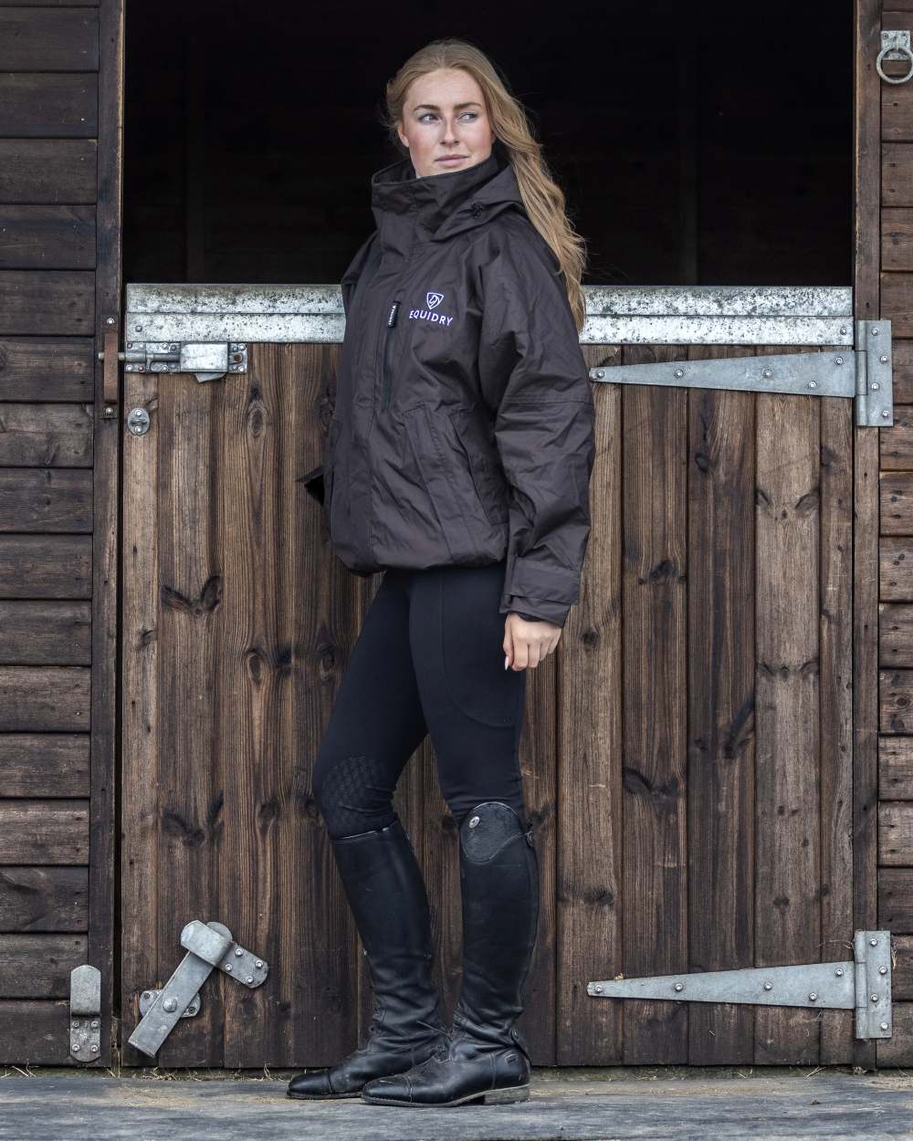 Rich Brown coloured Equidry Womens Shortie Mesh Lining Mac on stable background