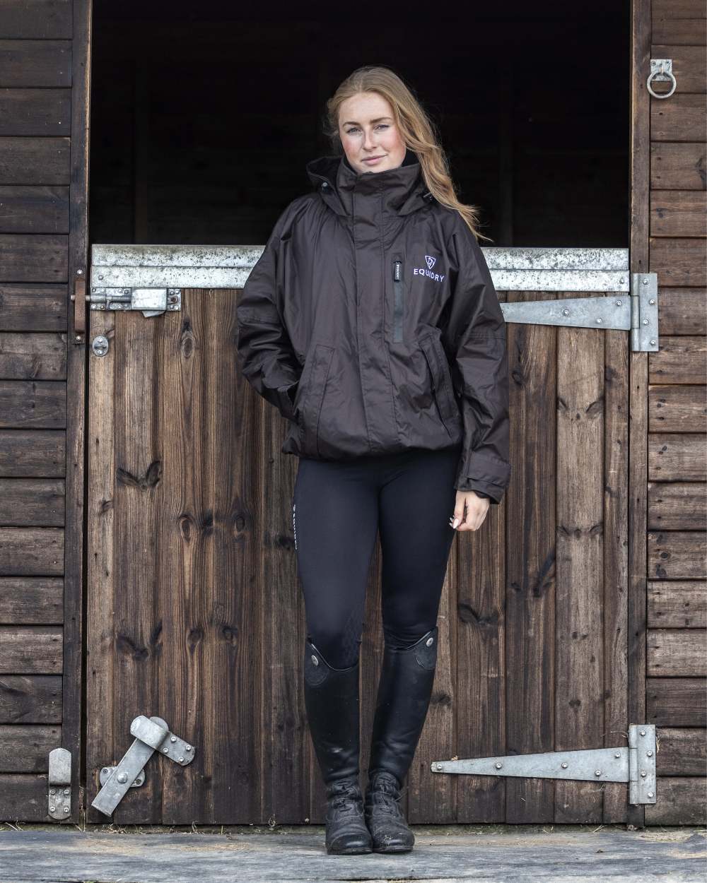 Rich Brown coloured Equidry Womens Shortie Mesh Lining Mac on stable background