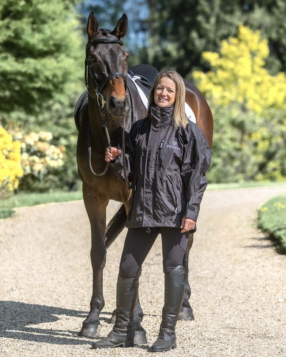 Rich Brown coloured Equidry Womens Shortie Mesh Lining Mac on yard background