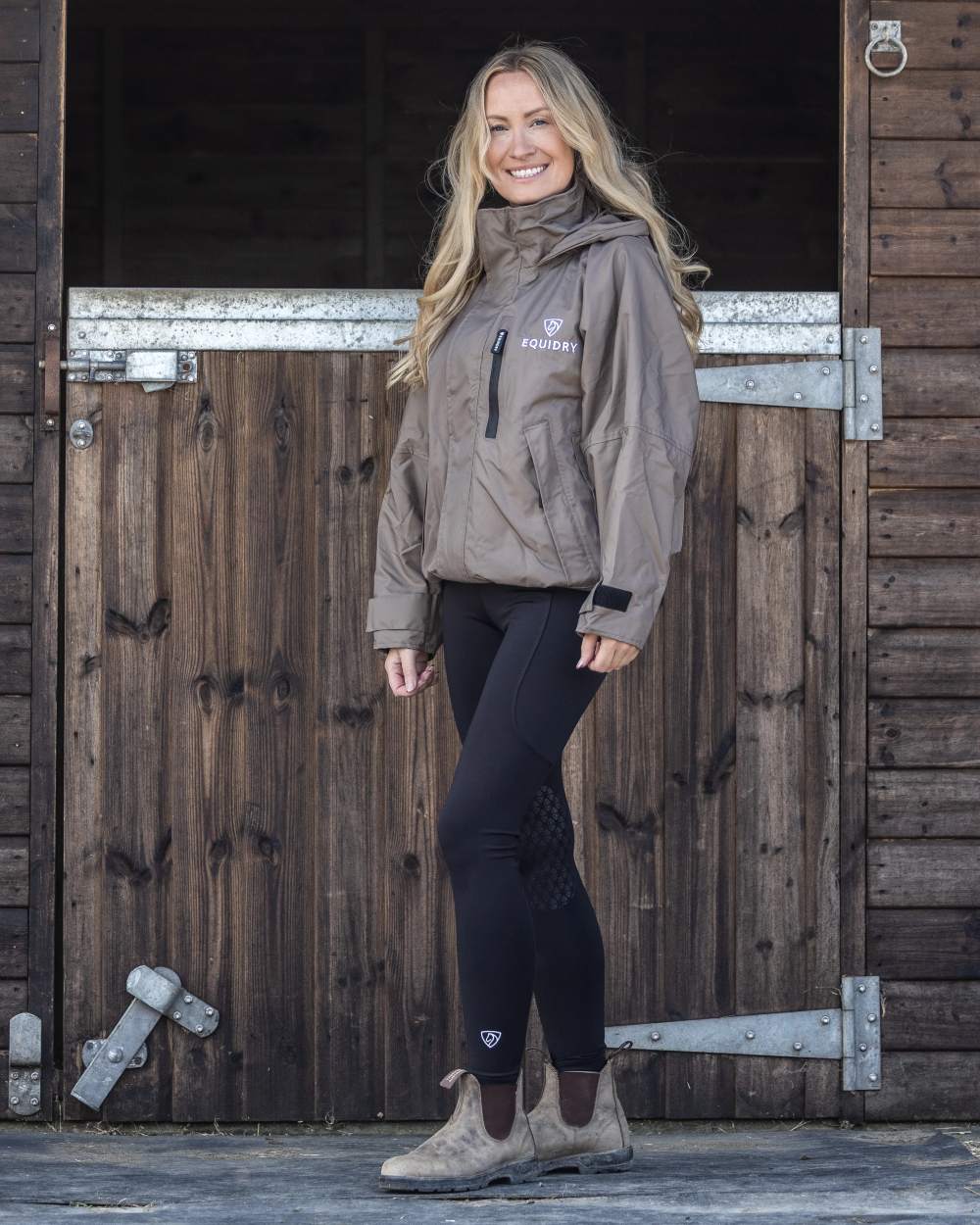 Taupe coloured Equidry Womens Shortie Mesh Lining Mac on stable background