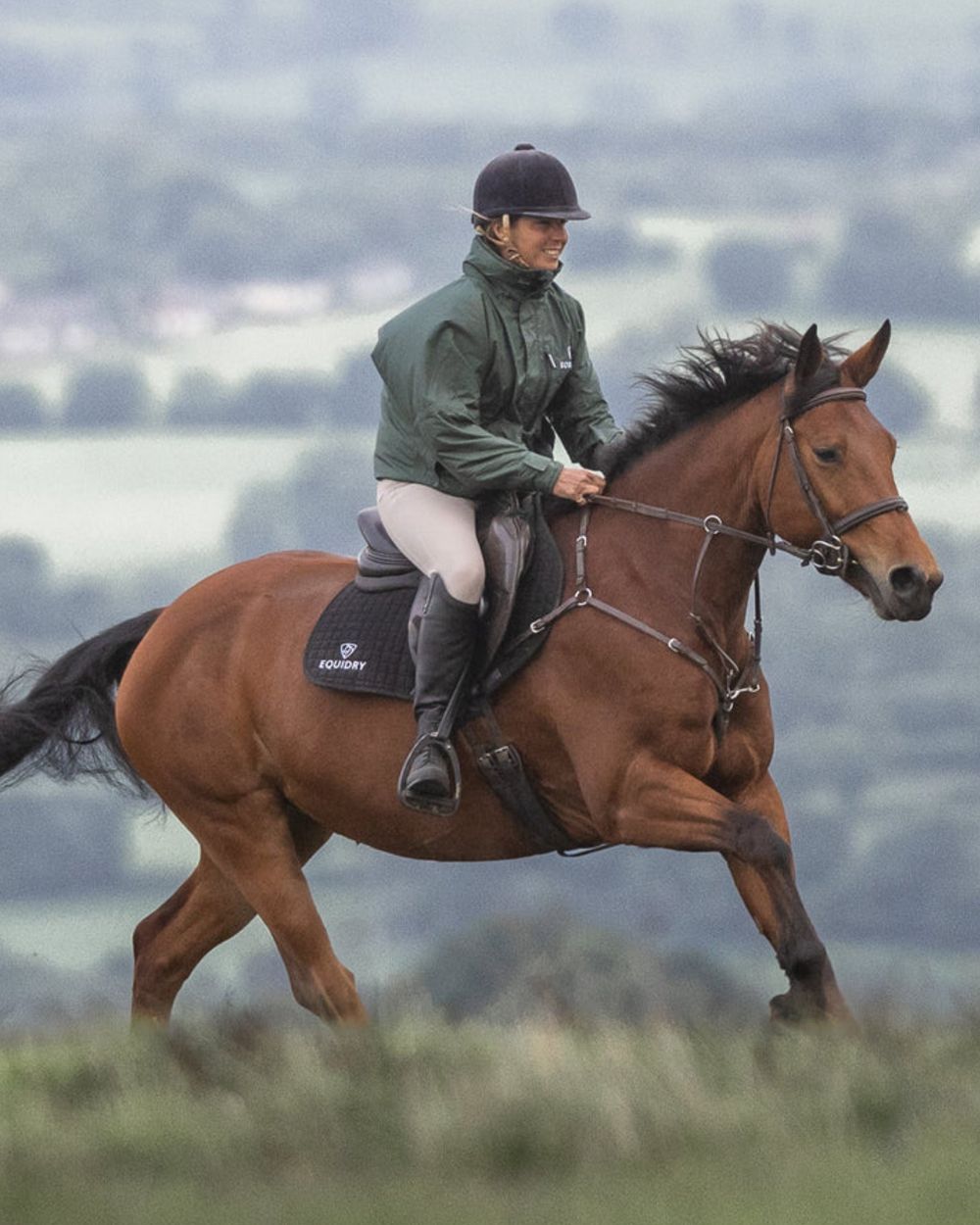 Black Forest Green coloured Equidry Womens Shortie Thin Fleece Jacket With Stowaway Hood on outdoor background