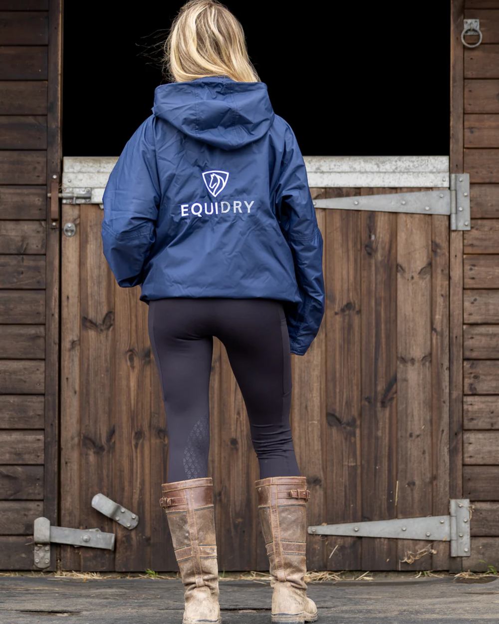 Navy coloured Equidry Womens Shortie Thin Fleece Jacket With Stowaway Hood on outdoor background