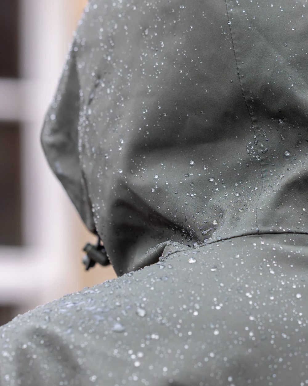 Black Forest Green coloured Equidry Womens Storm Smock With Velour Lining on outdoor background