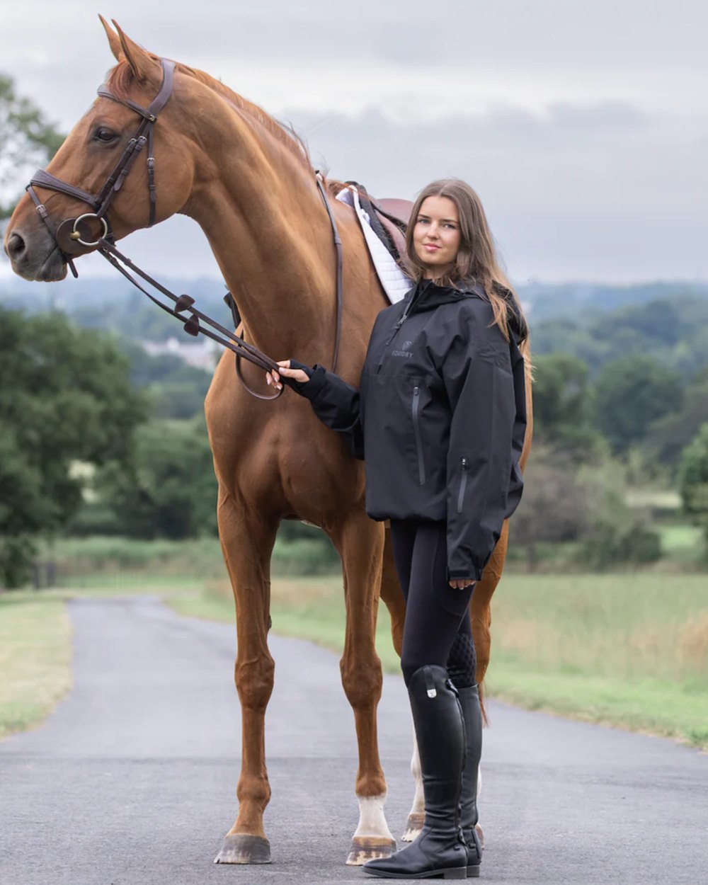 Black coloured Equidry Womens Storm Smock With Velour Lining on outdoor background