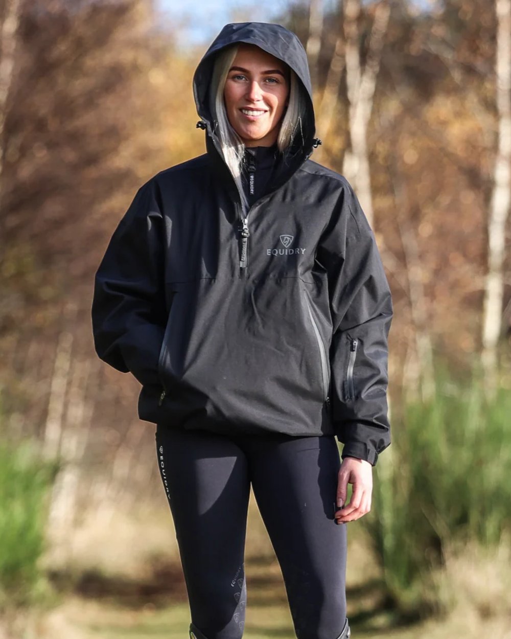 Black coloured Equidry Womens Storm Smock With Velour Lining on outdoor background