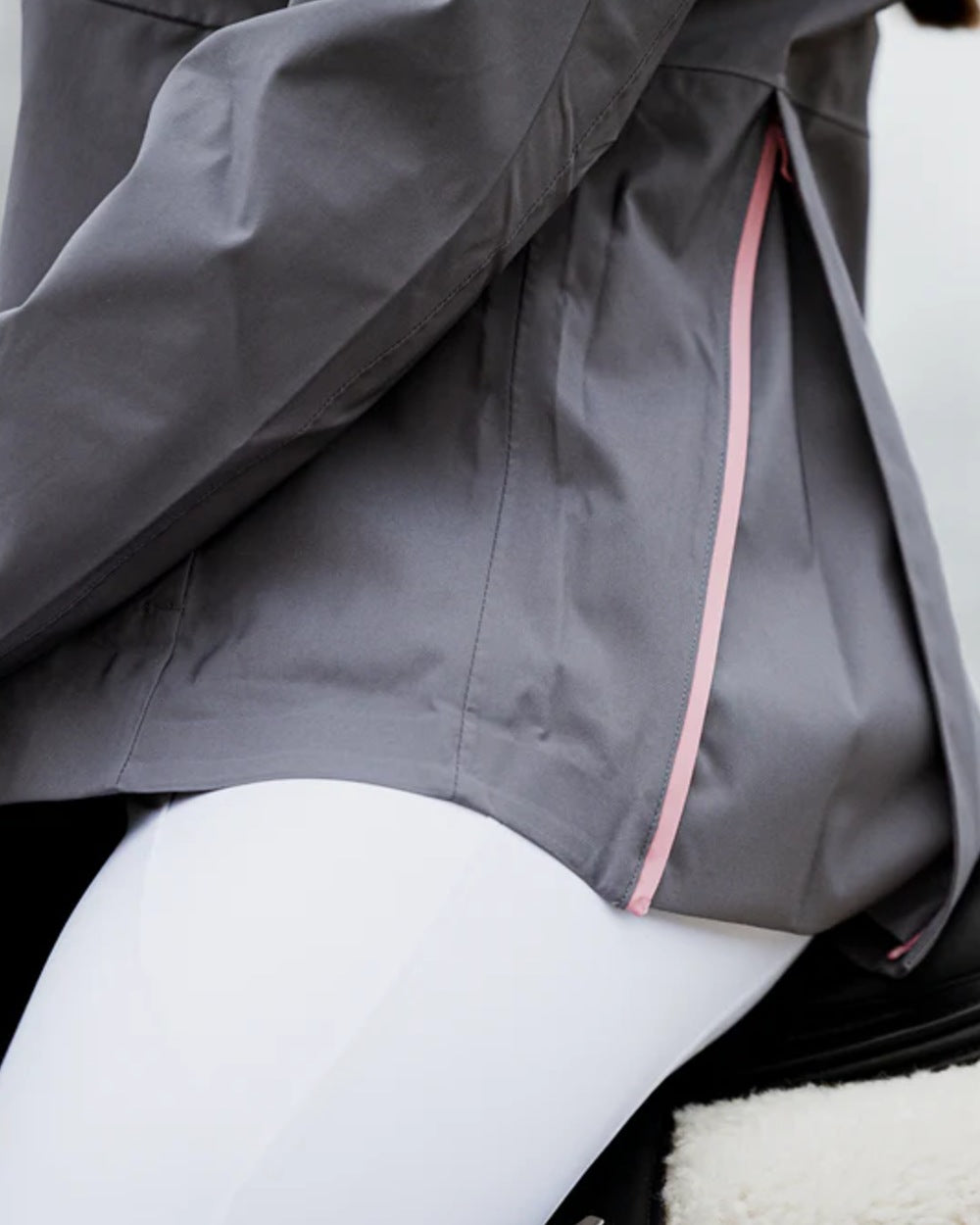 Charcoal Pink coloured Equidry Womens Varsha Jacket with Stowaway Hood on outdoor background