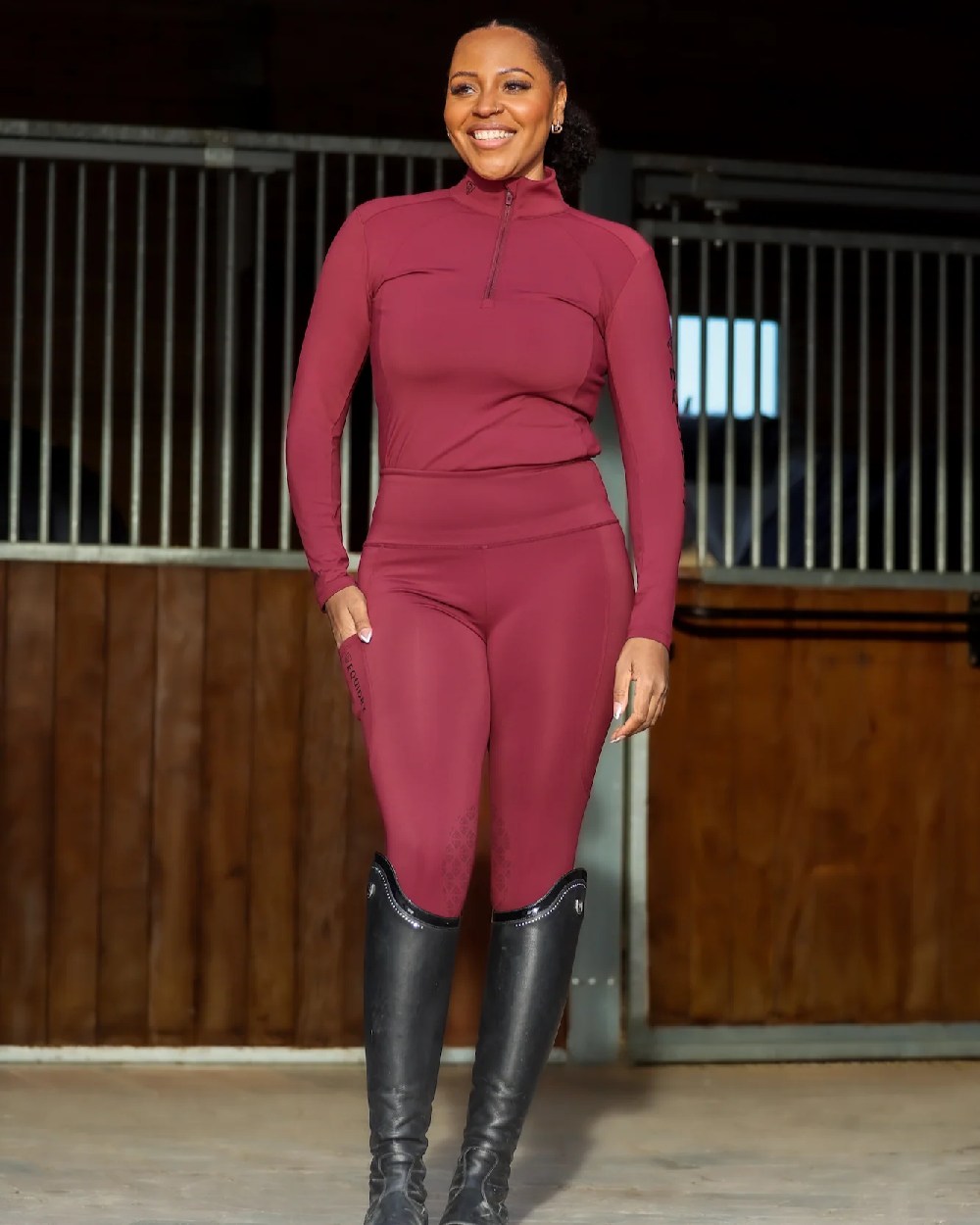 Plum Black Coloured Equidry Womens Water Repellent Base Layer on outdoor background