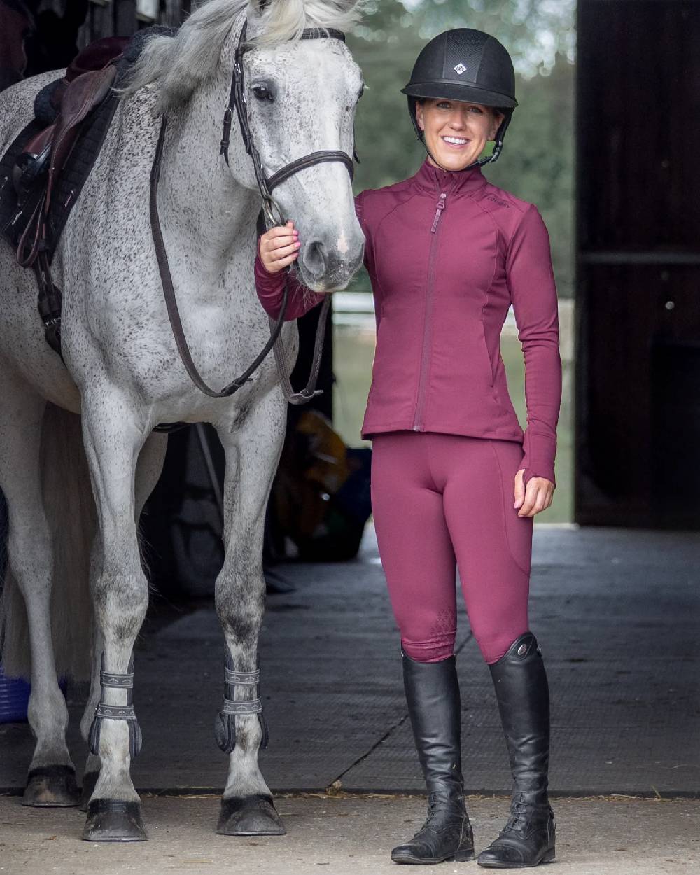 Plum Black Coloured Equidry Womens Water Repellent Zip Up Top on outdoor background