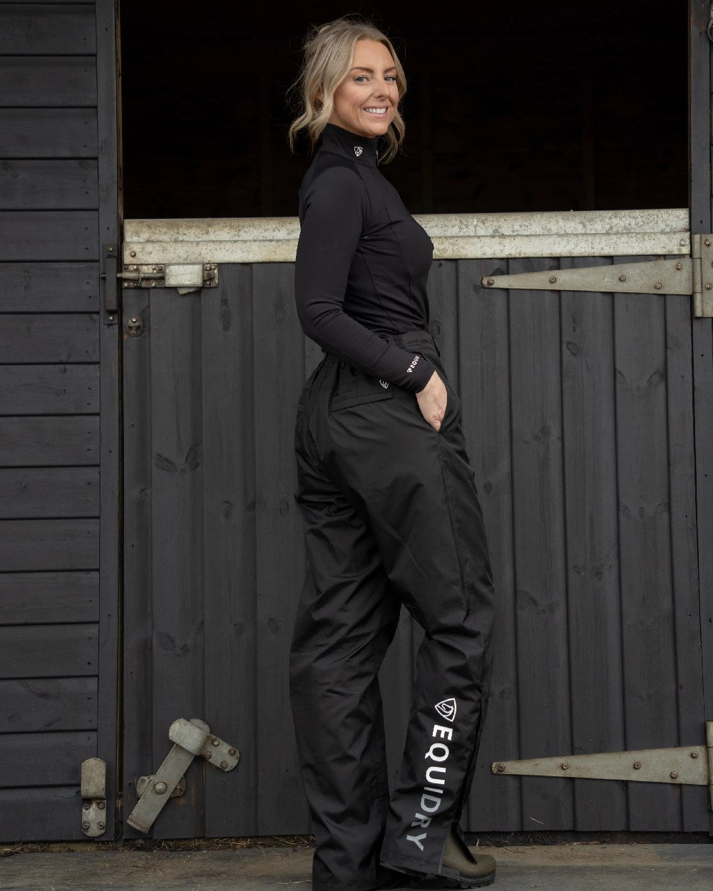 Black Coloured Equidry Womens Waterproof Fleece Lined Trousers on outdoor background