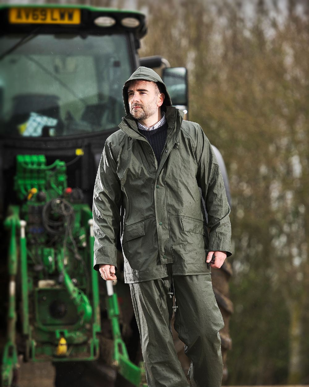 Olive coloured Fort Airflex Fortex Breathable Waterproof Jacket on blurry background