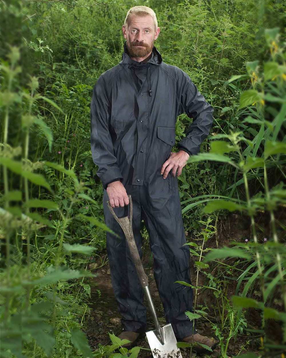 Navy coloured Fort Fortex Flex Coverall on green background