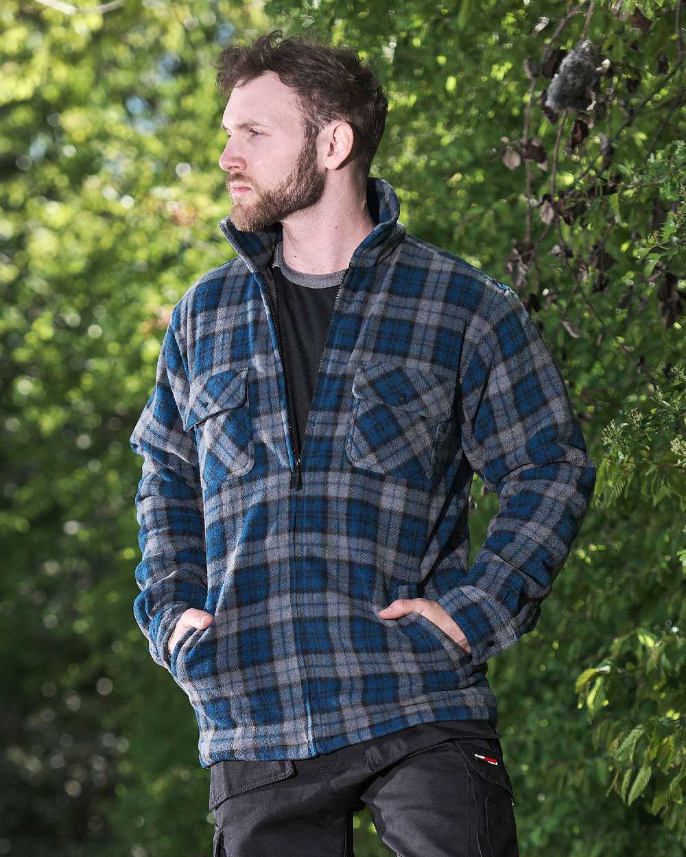 Navy Blue coloured Fort Portman Fleece Jacket on green background