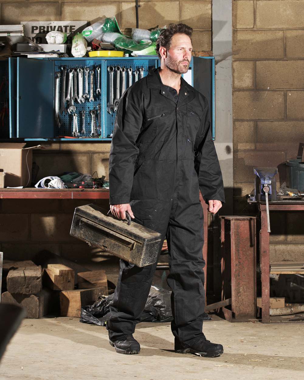 Black coloured Fort Zip Front Boilersuit on blurry background