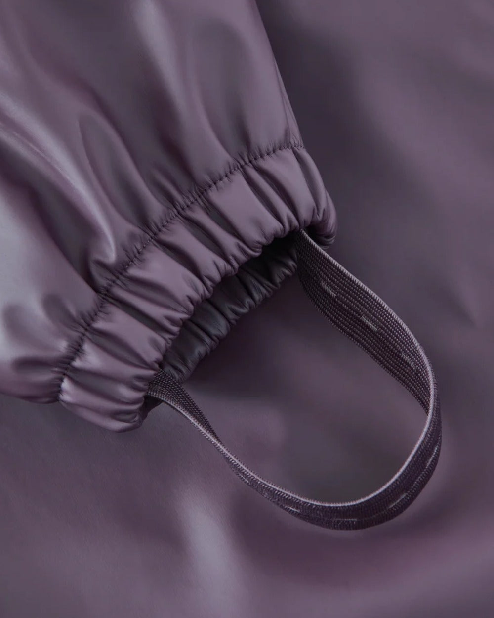 Amethyst Purple coloured Grass & Air Childrens Puddle Suit on white background