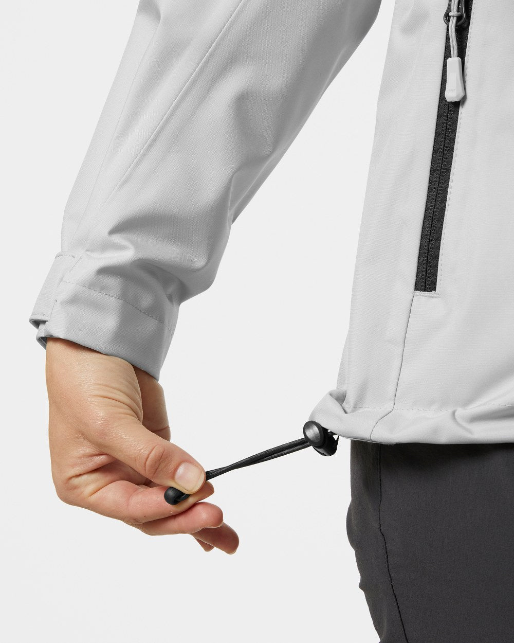 Grey Fog coloured Helly Hansen womens crew hooded sailing jacket 2.0 on grey background