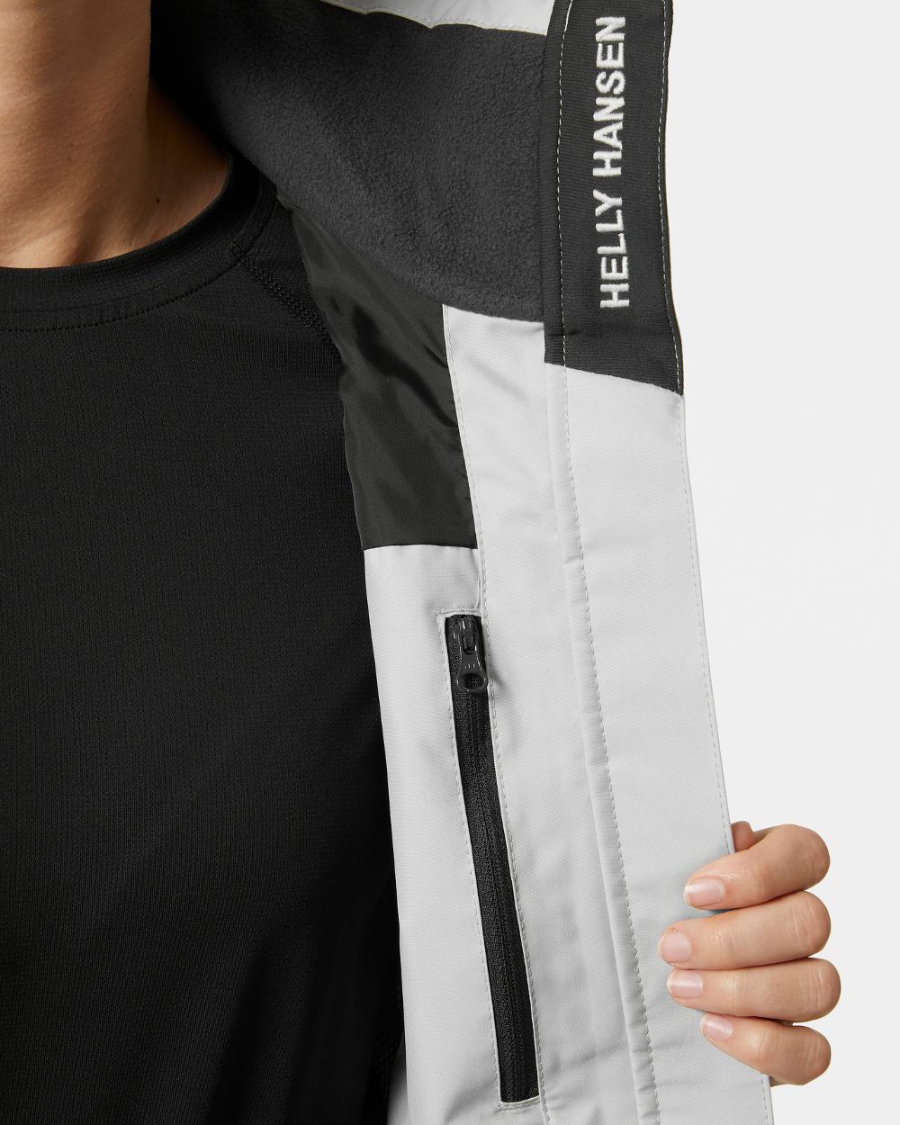 Grey Fog coloured Helly Hansen womens crew hooded sailing jacket 2.0 on grey background