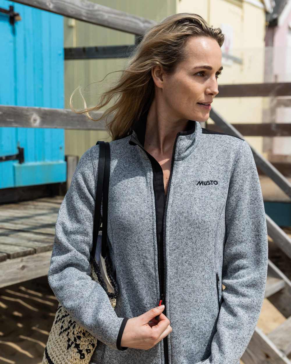 Grey Melange Coloured Musto Womens Knitted Fleece On A Shack Background 