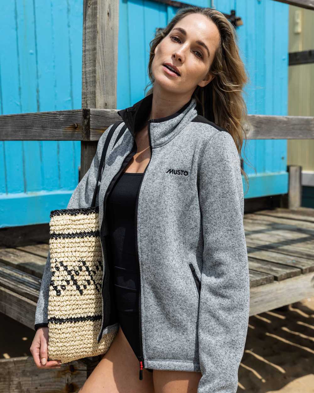 Grey Melange Coloured Musto Womens Knitted Fleece On A Shack Background