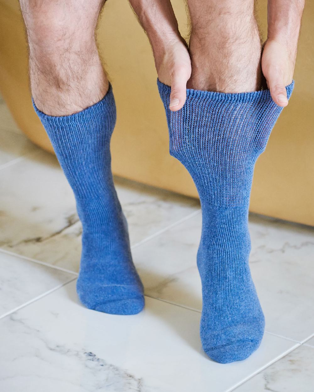 Denim coloured HJ Hall Cotton Rich Diabetic Socks on house background