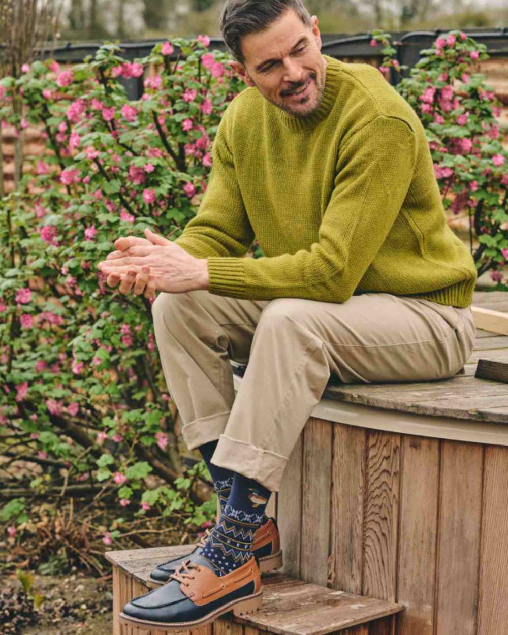 Navy coloured HJ Hall Country Animal Fairisle Socks on garden background