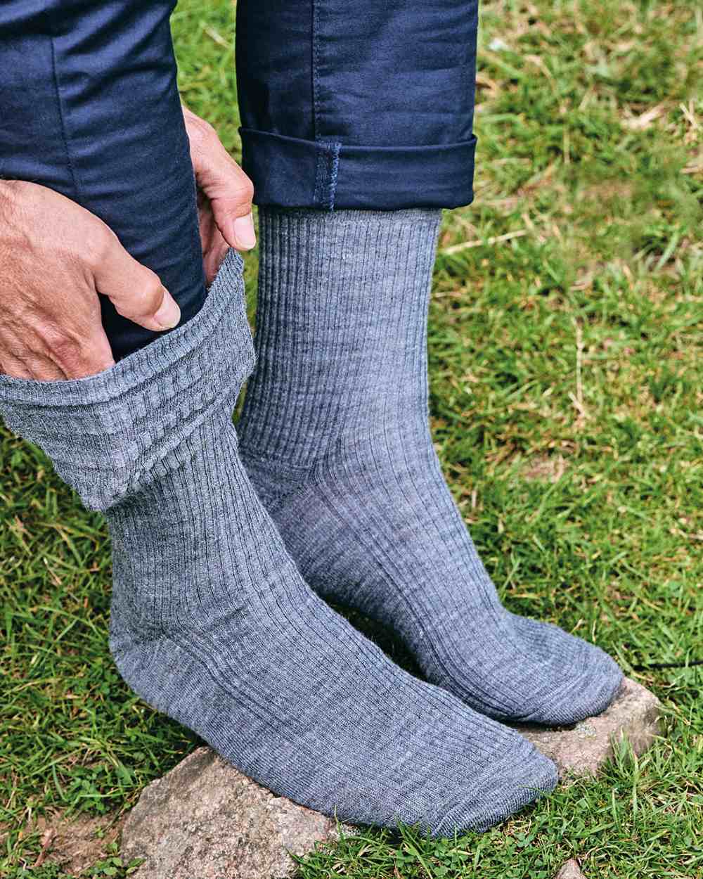 Grey coloured HJ Hall Extra Wide Soft Top Sock Sanitised Wool on grass background