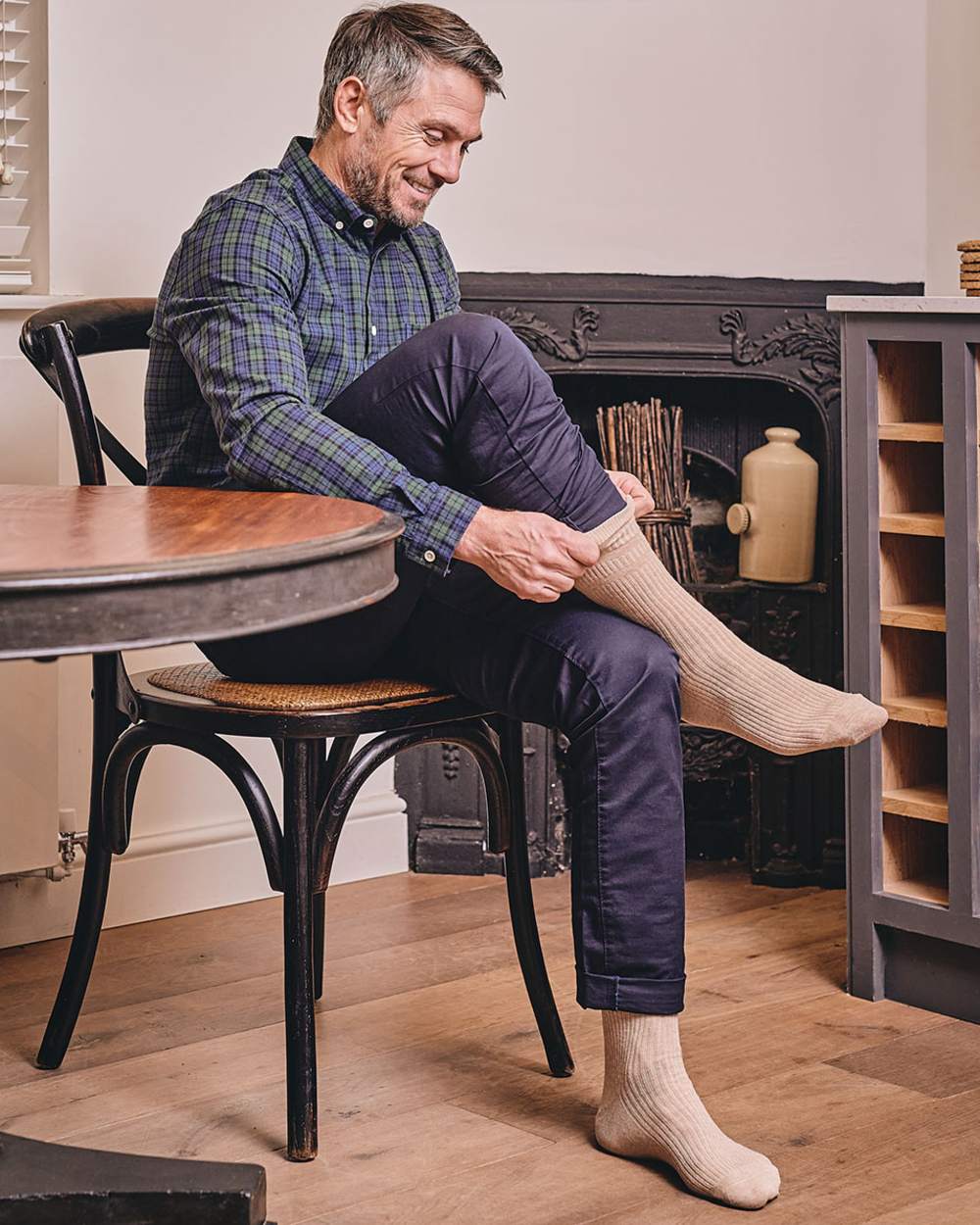 Oatmeal coloured HJ Hall Extra Wide Soft Top Sock Sanitised Wool on indoor background