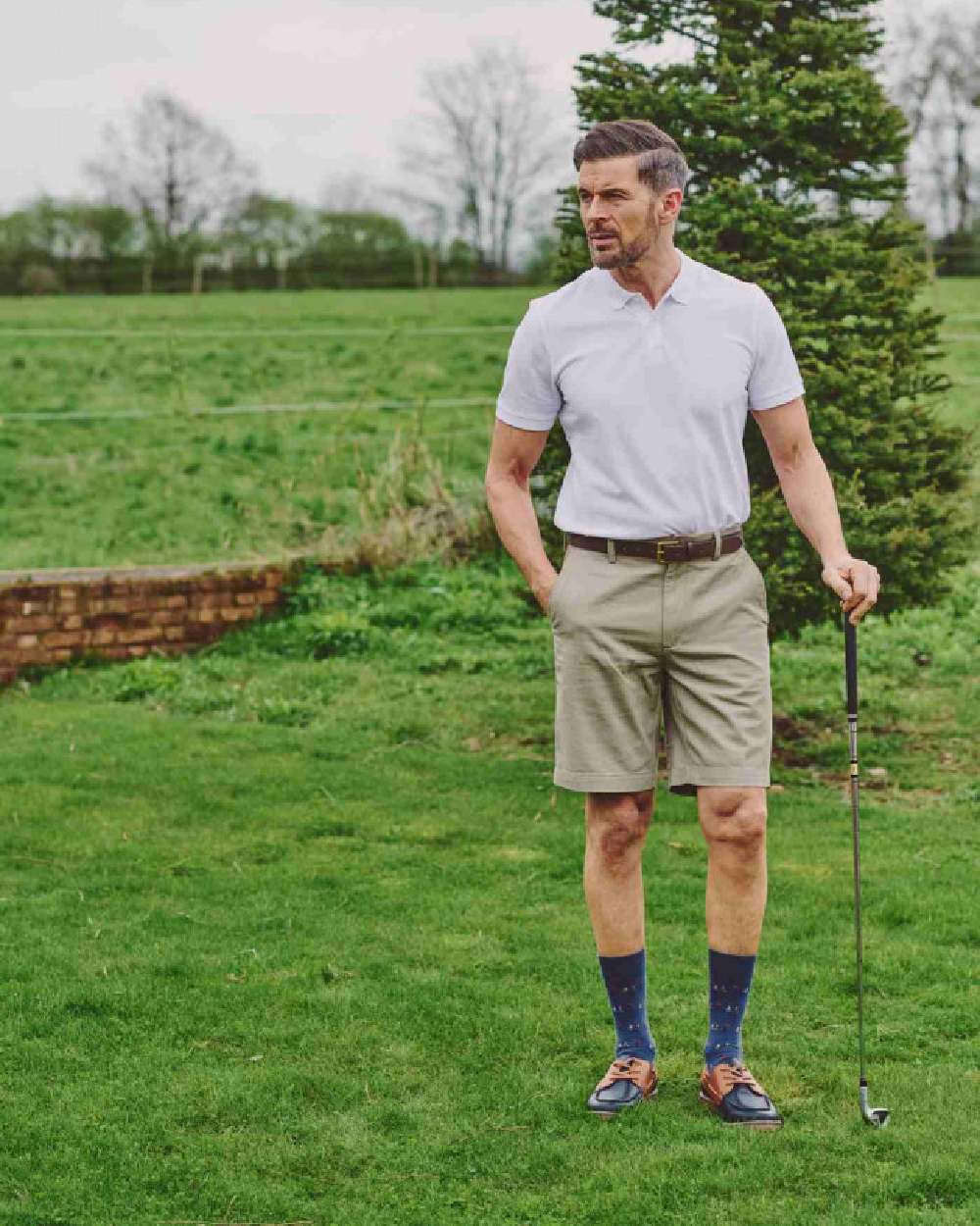 Slate Blue coloured HJ Hall Mens Golf 3 Pair Pack Socks on golf field background