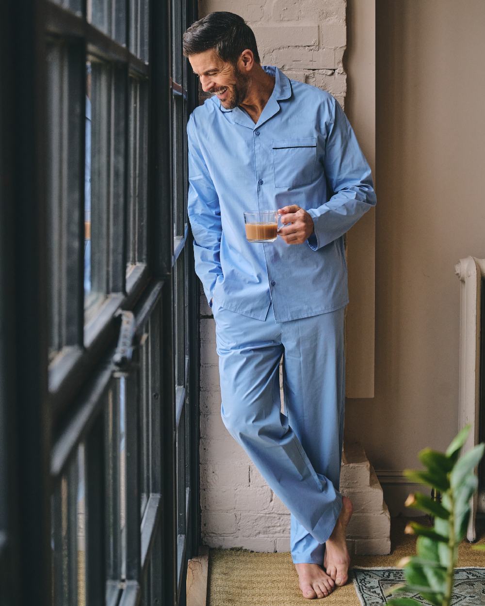 Light Blue Coloured HJ Hall Mens Pure Cotton Pyjamas on indoor background