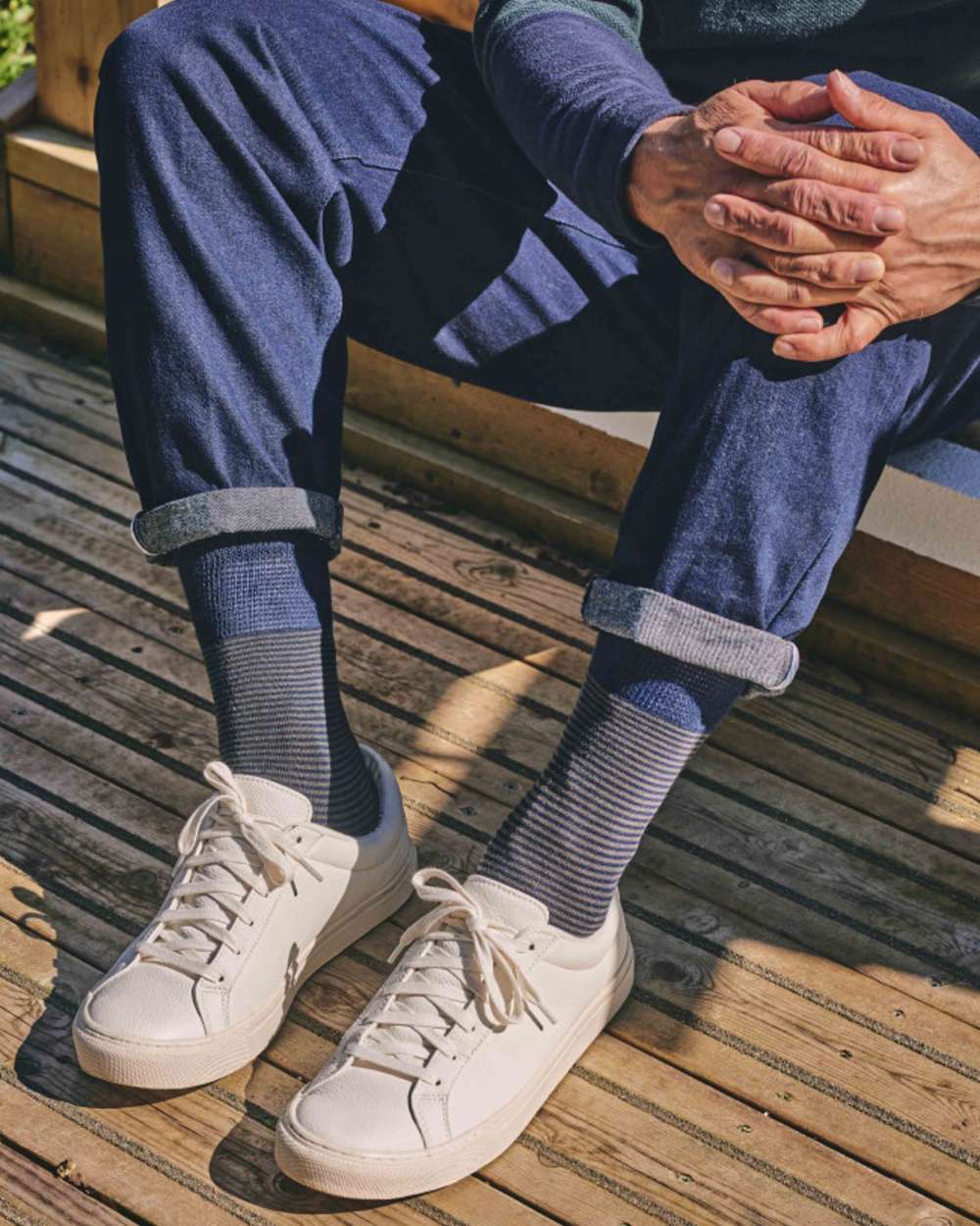 Navy Khaki coloured HJ Hall Narrow Stripe Bamboo Comfort Top Socks on backyard background
