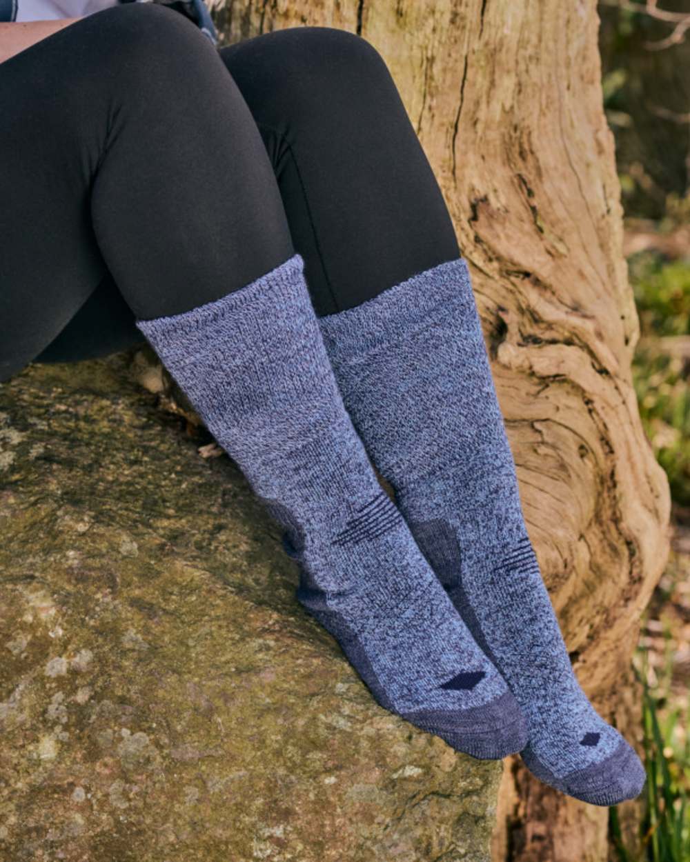 Navy coloured HJ Hall Technical Rambler Comfort Top Thermal Wool Socks on forest background