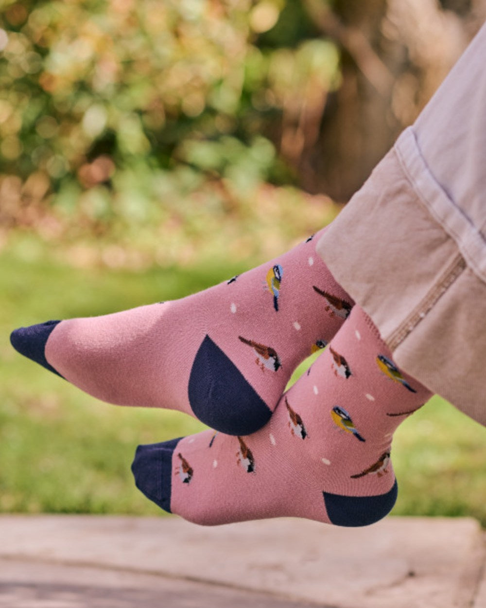Pink coloured HJ Hall Womens Garden Birds Motif Cotton Comfort Top Socks on outdoor background