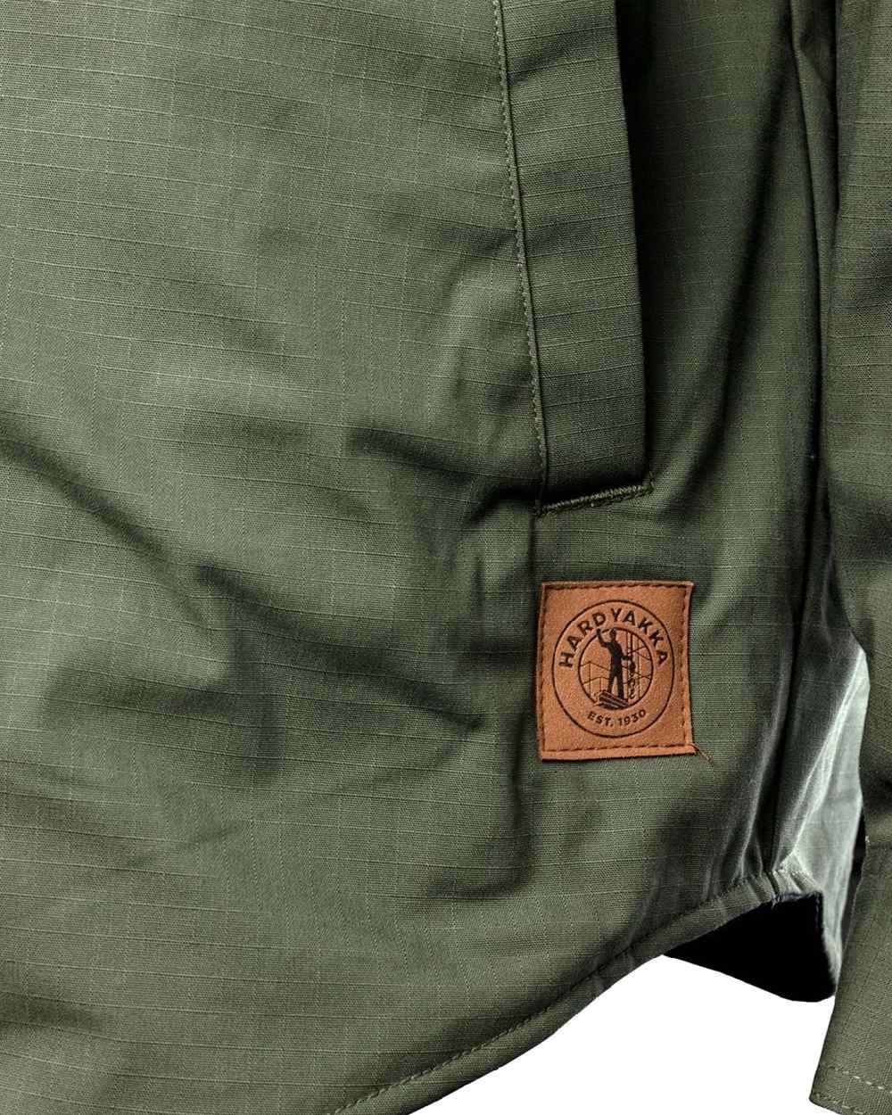 Military Green coloured Hard Yakka Mens Quilted Solid Shacket on white background