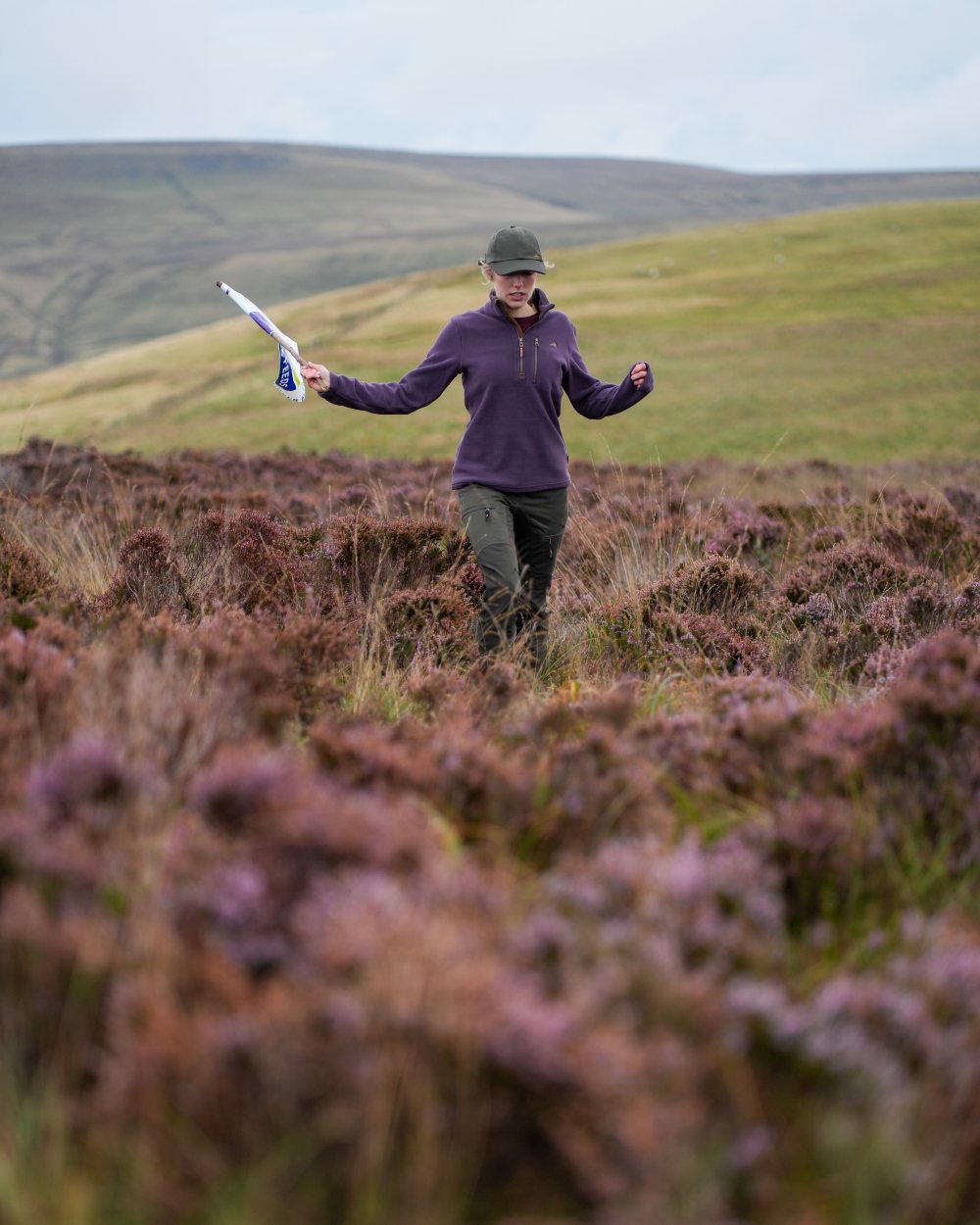 Purple coloured Harehill Womens Varden Fleece Quarter Zip Fleece on a moorland background