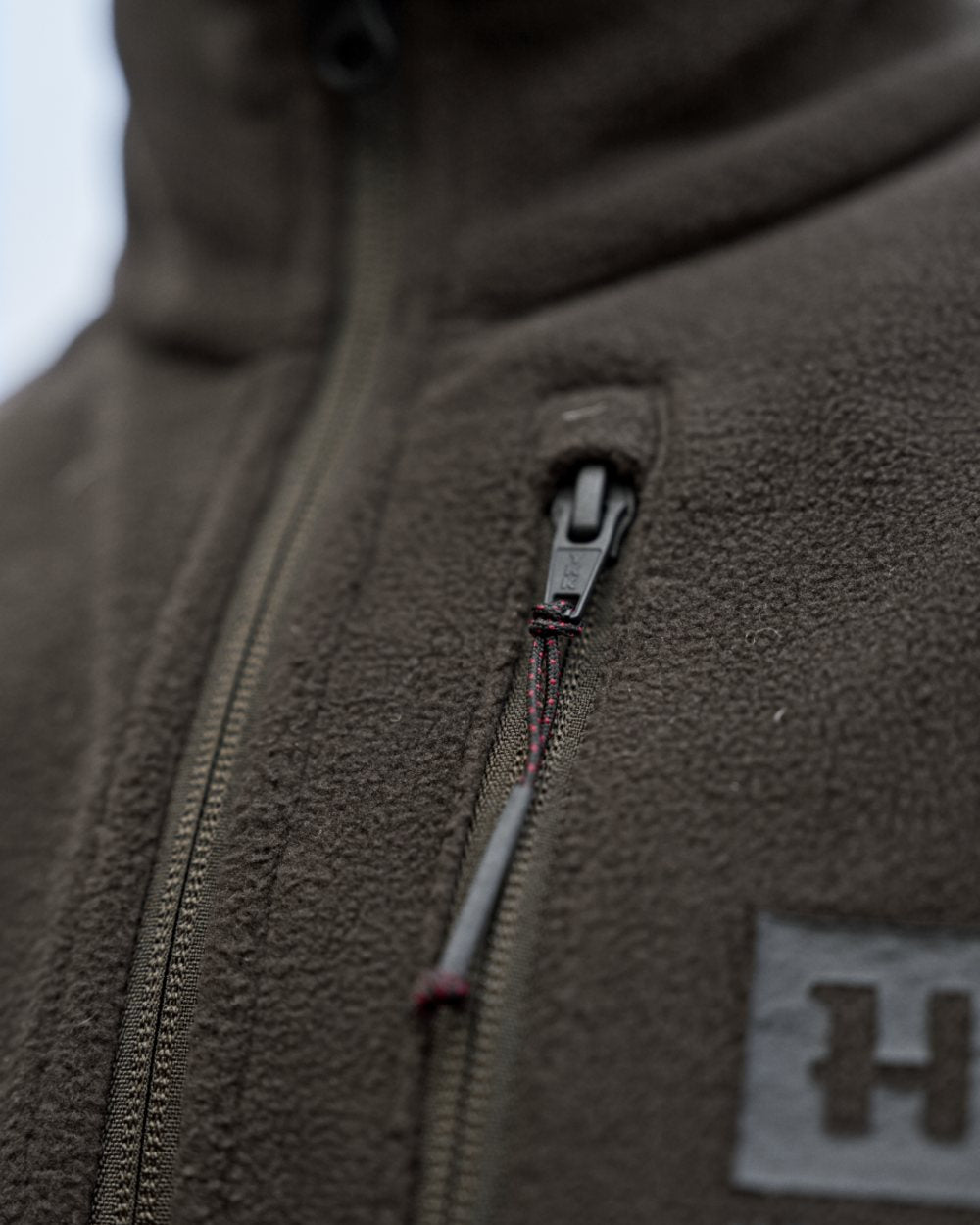 Shadow Brown Coloured Harkila Aspire Fleece Waistcoat on outdoor background