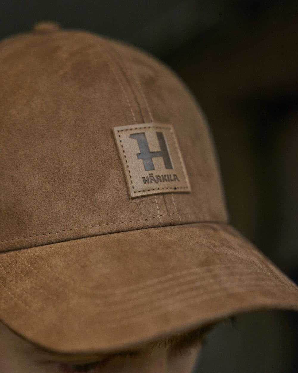 Antique Bronze Coloured Harkila Berkshire Cap on outdoor background