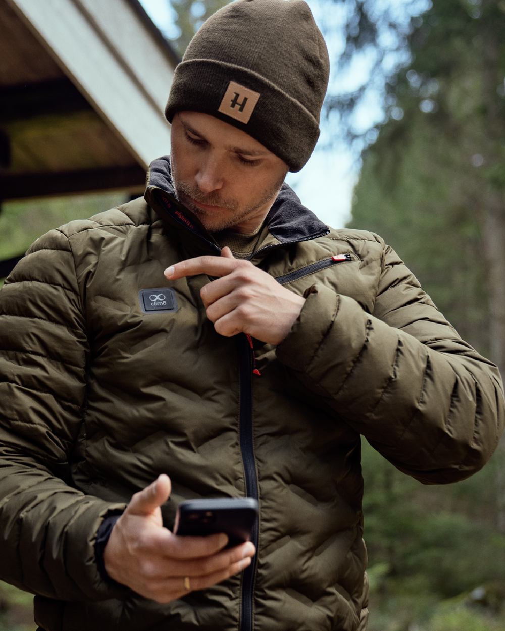 Willow Green Coloured Harkila Clim8 Insulated Jacket on outdoor background