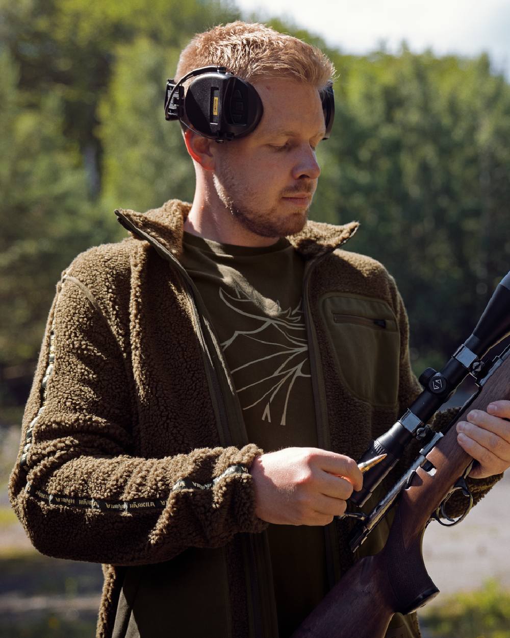 Shadow Grey Willow Green Coloured Harkila Rurik Teddy Fleece on forest background