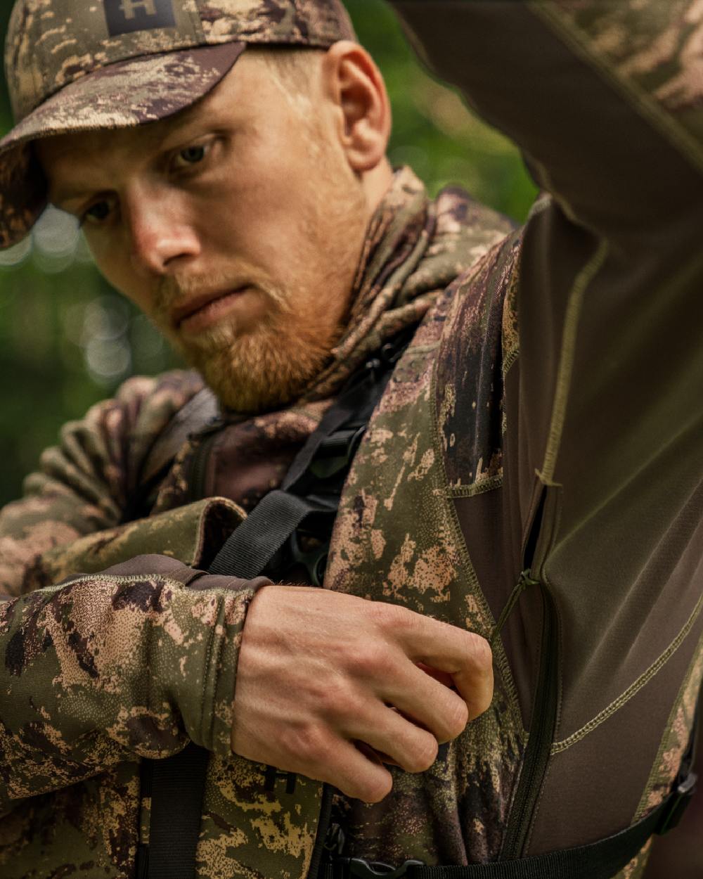AXIS Forest Coloured Harkila Deer Stalker Camo Fleece Hoodie on blurry background