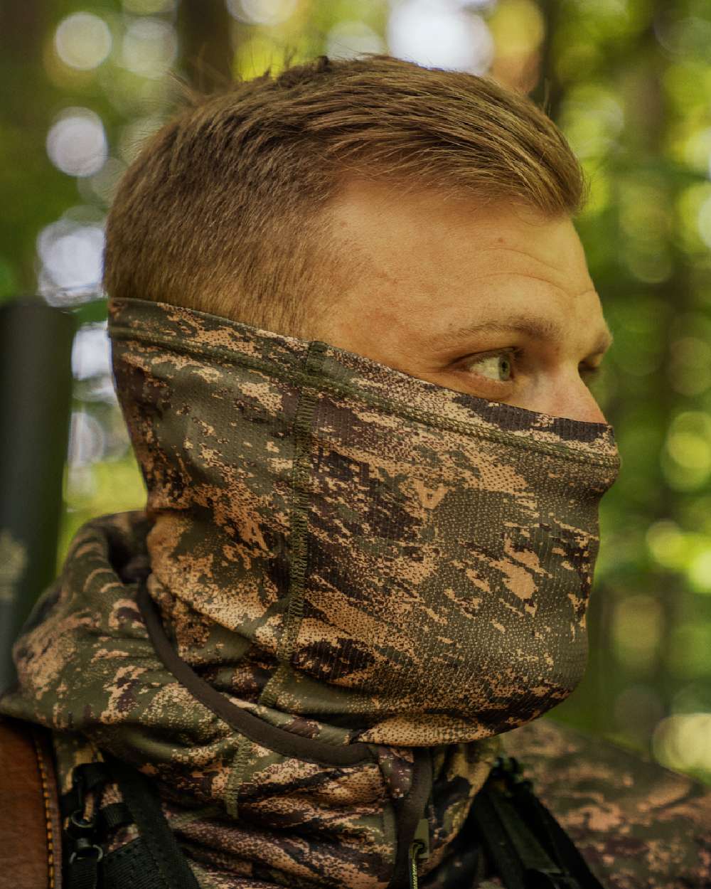 AXIS Forest Coloured Harkila Deer Stalker Camo Neck Gaiter on blurry background