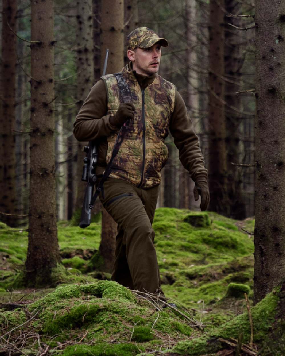 Willow Green AXIS Forest Coloured Harkila Deer Stalker Camo Reversible Packable Waistcoat on forest background