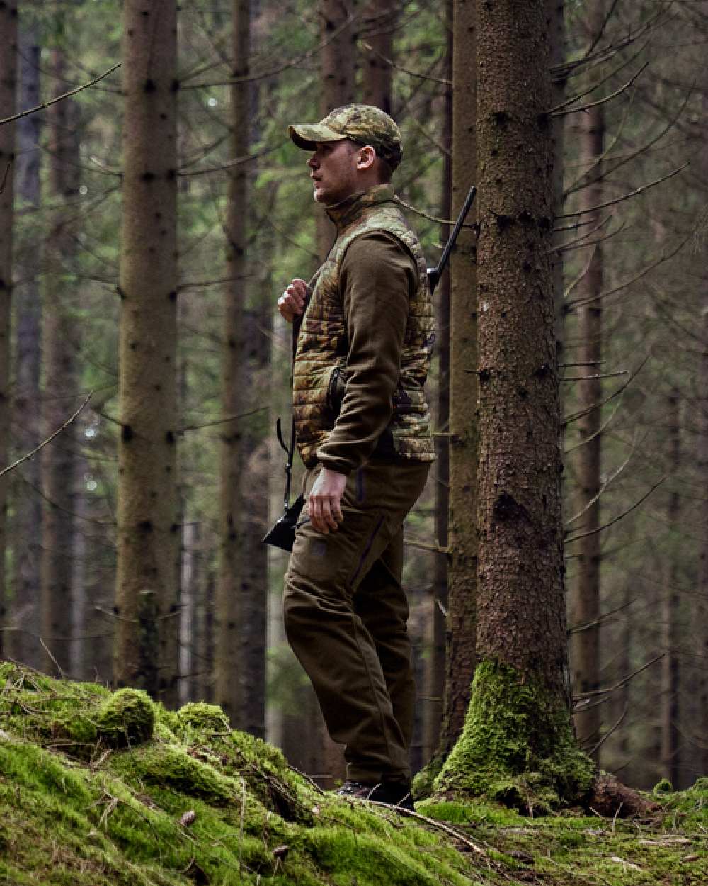 Willow Green AXIS Forest Coloured Harkila Deer Stalker Camo Reversible Packable Waistcoat on forest background