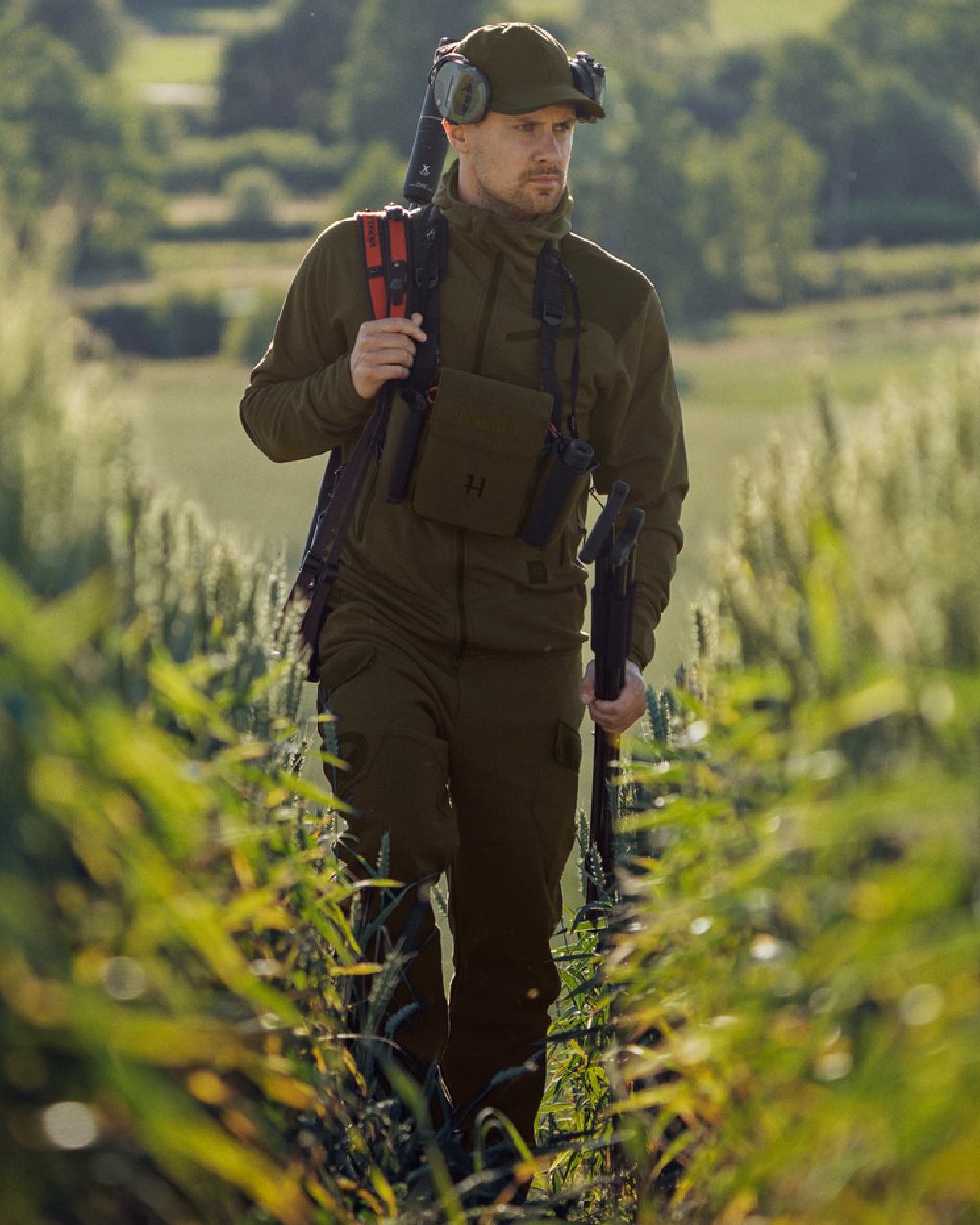 Willow Green Shadow Brown Coloured Harkila Deer Stalker Fleece Hoodie on outdoor background