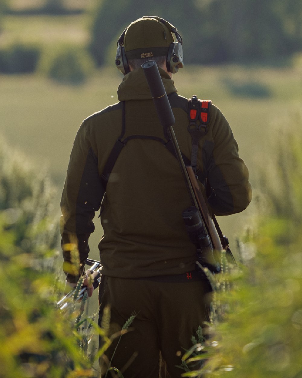 Willow Green Shadow Brown Coloured Harkila Deer Stalker Fleece Hoodie on outdoor background