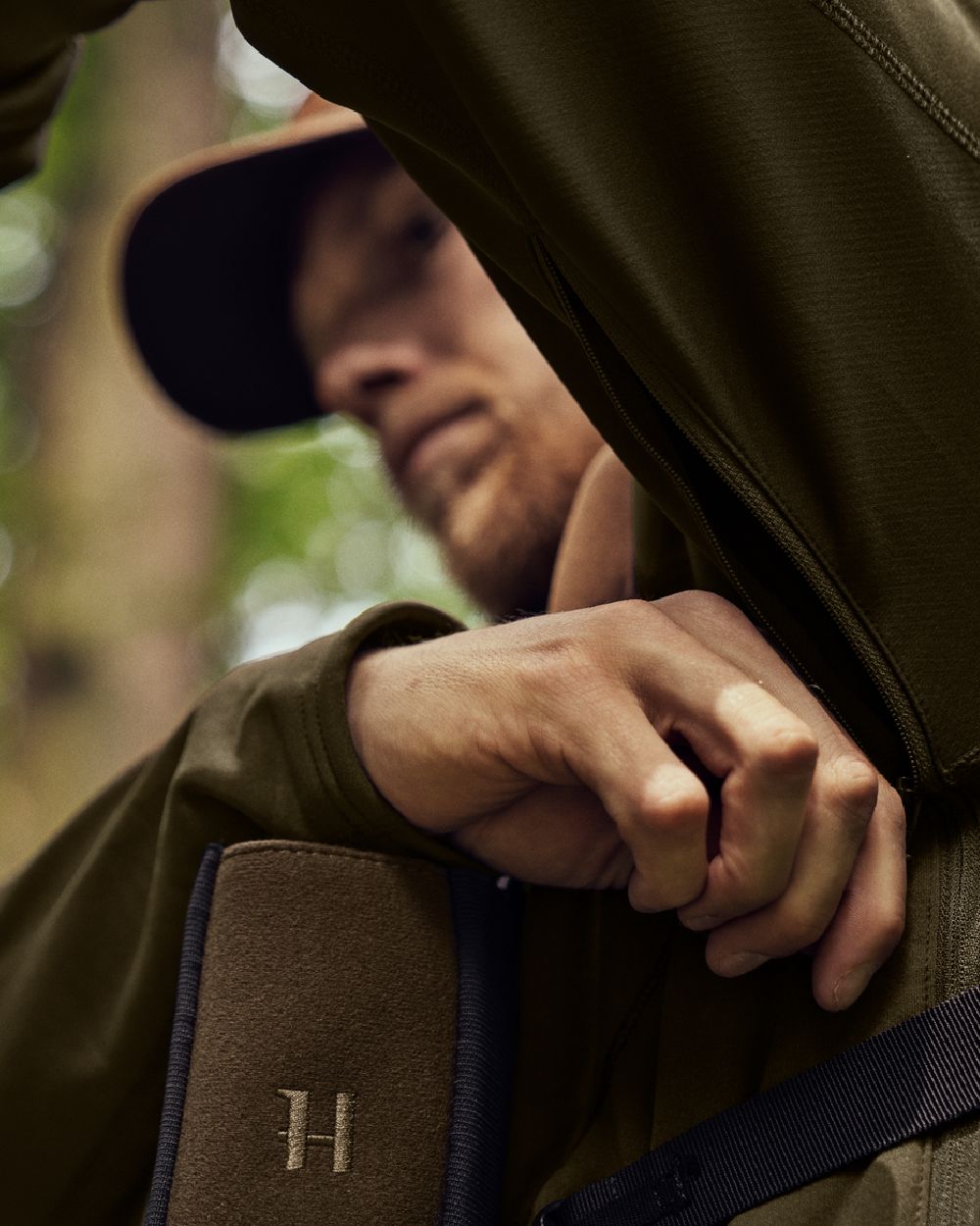 Willow Green Shadow Brown Coloured Harkila Deer Stalker Fleece Hoodie on outdoor background