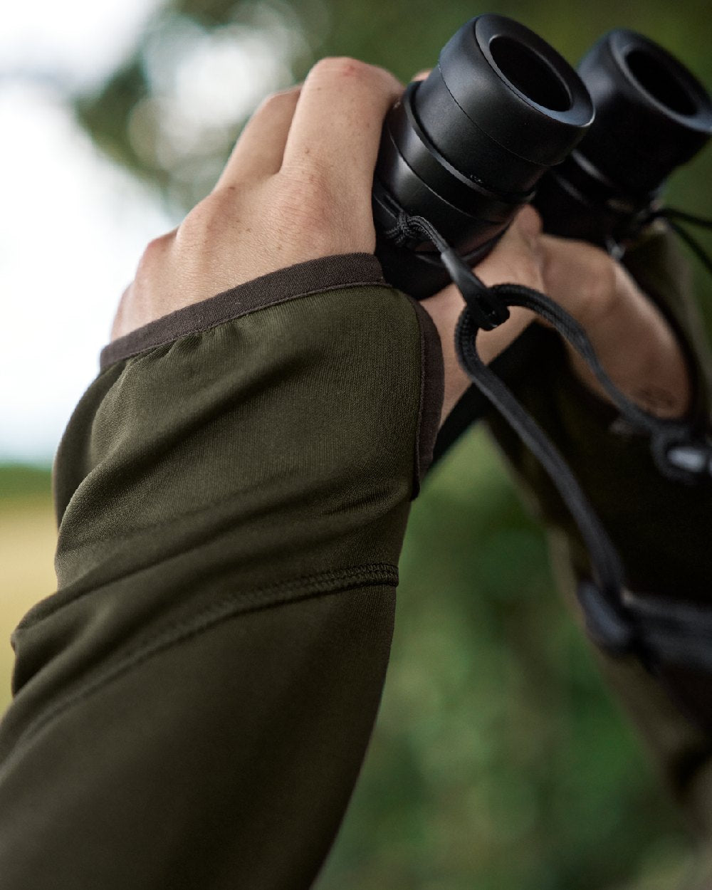 Willow Green Coloured Harkila Deer Stalker Full Zip Fleece Hoodie on blurry background