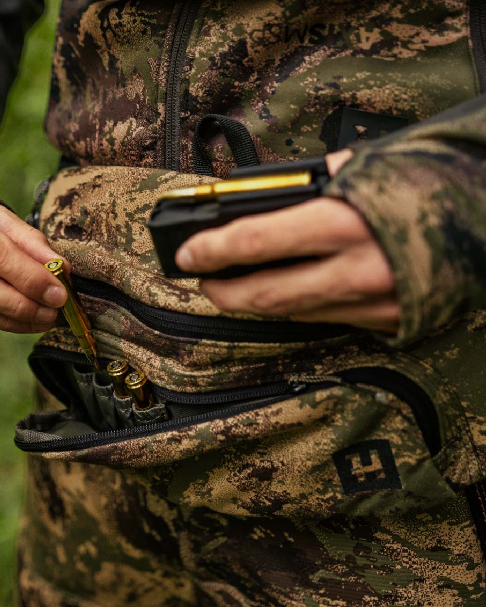 AXIS Forest Coloured Harkila Deer Stalker Waist Pack on outdoor background