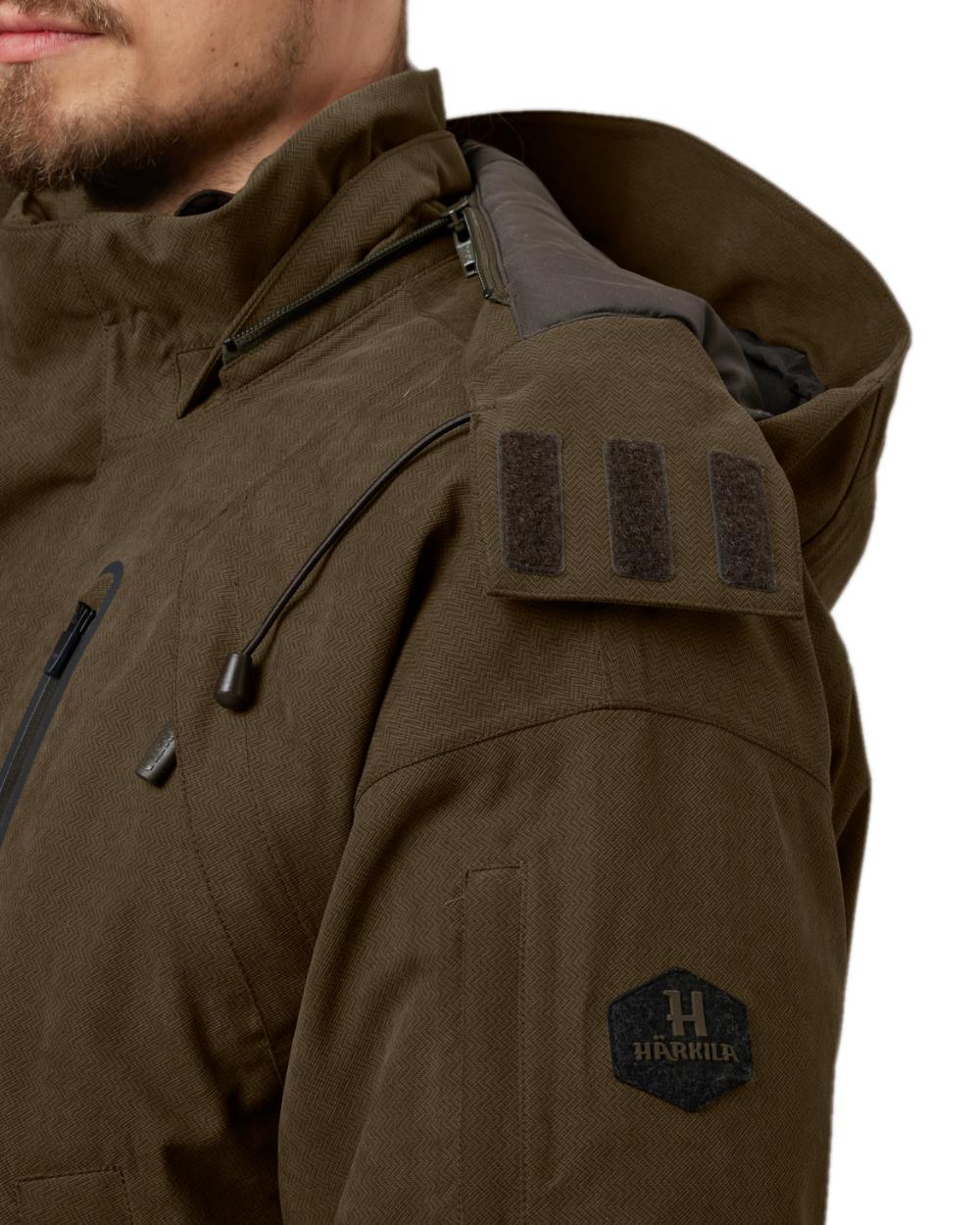 Willow Green Coloured Harkila Driven Hunt HWS Insulated Jacket on white background