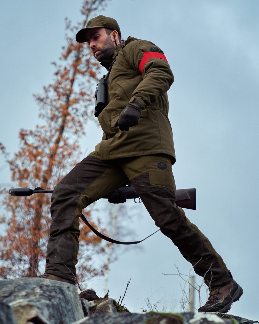 Willow Green Shadow Brown Coloured Harkila Driven Hunt HWS Leather Trousers on forest background