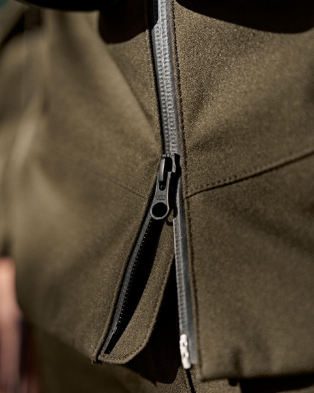 Hunting Green Coloured Harkila Finnmark HWS Jacket on blurry background